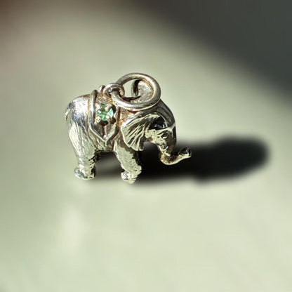 Agete Elephant Pendant Top with emerald and sapphire side stones showing tarnish and black spots