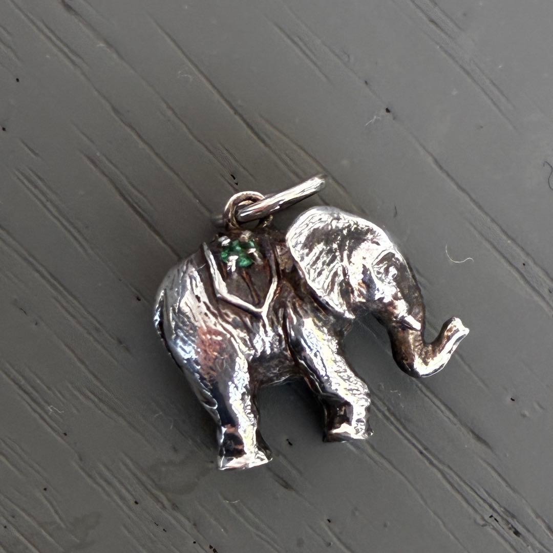 Agete Elephant Pendant Top with emerald and sapphire side stones showing tarnish and black spots