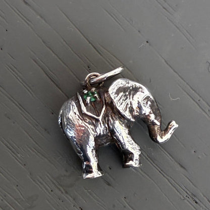 Agete Elephant Pendant Top with emerald and sapphire side stones showing tarnish and black spots
