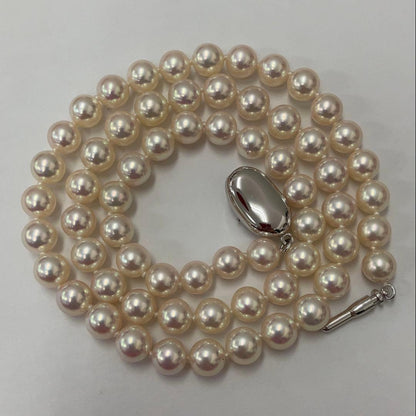 Akoya pearl necklace with approximately 6.7mm pearls and 43cm length on a white background