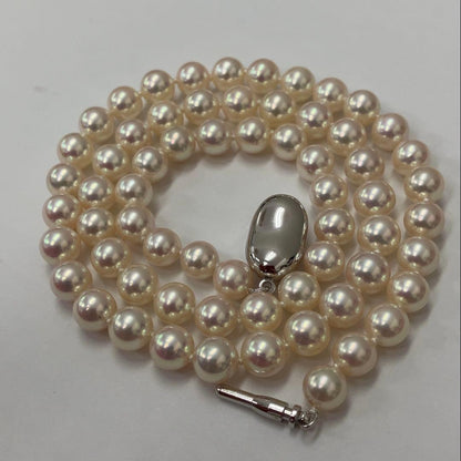 Akoya pearl necklace with approximately 6.7mm pearls and 43cm length on a white background