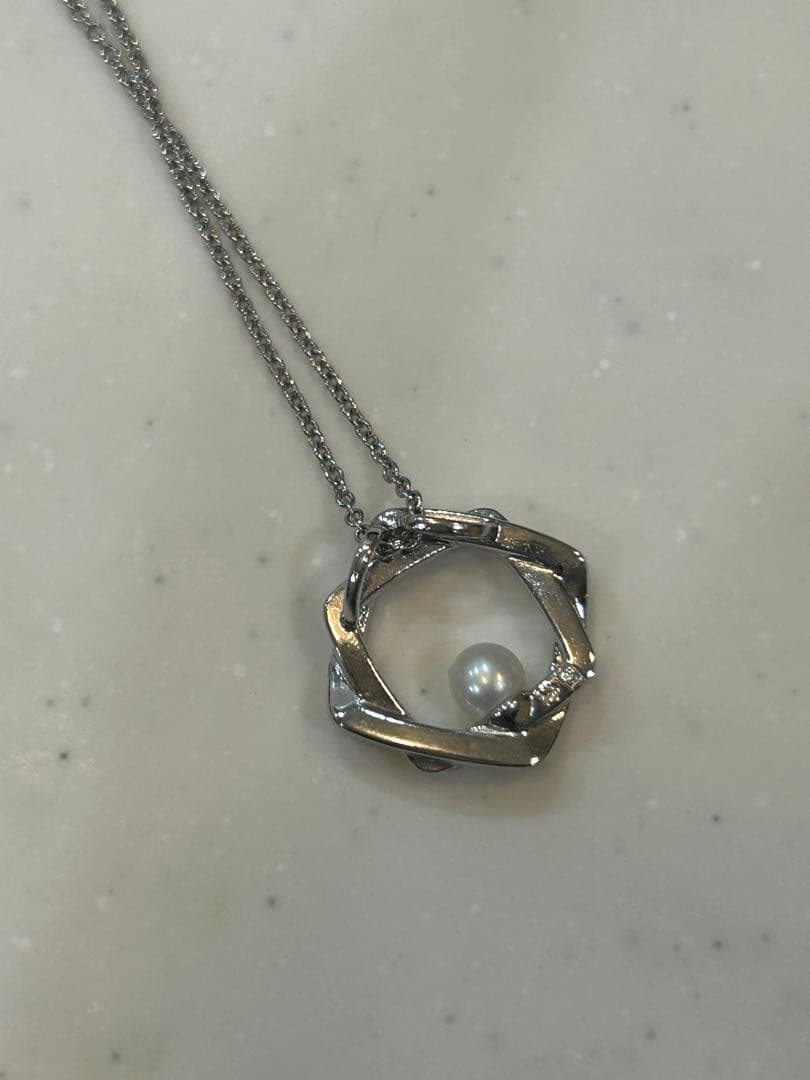 Tasaki baby pearl necklace with silver SV925 chain and pearl pendant displayed with a box