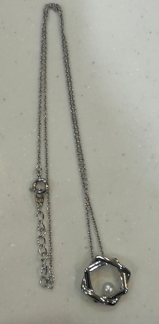 Tasaki baby pearl necklace with silver SV925 chain and pearl pendant displayed with a box