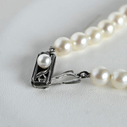 Highest grade Hanadama Mikimoto Akoya pearl necklace with 6.5mm round pearls and silver chain length 37cm