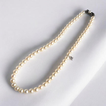Highest grade Hanadama Mikimoto Akoya pearl necklace with 6.5mm round pearls and silver chain length 37cm