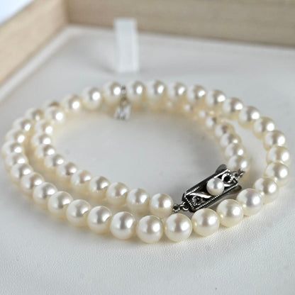 Highest grade Hanadama Mikimoto Akoya pearl necklace with 6.5mm round pearls and silver chain length 37cm