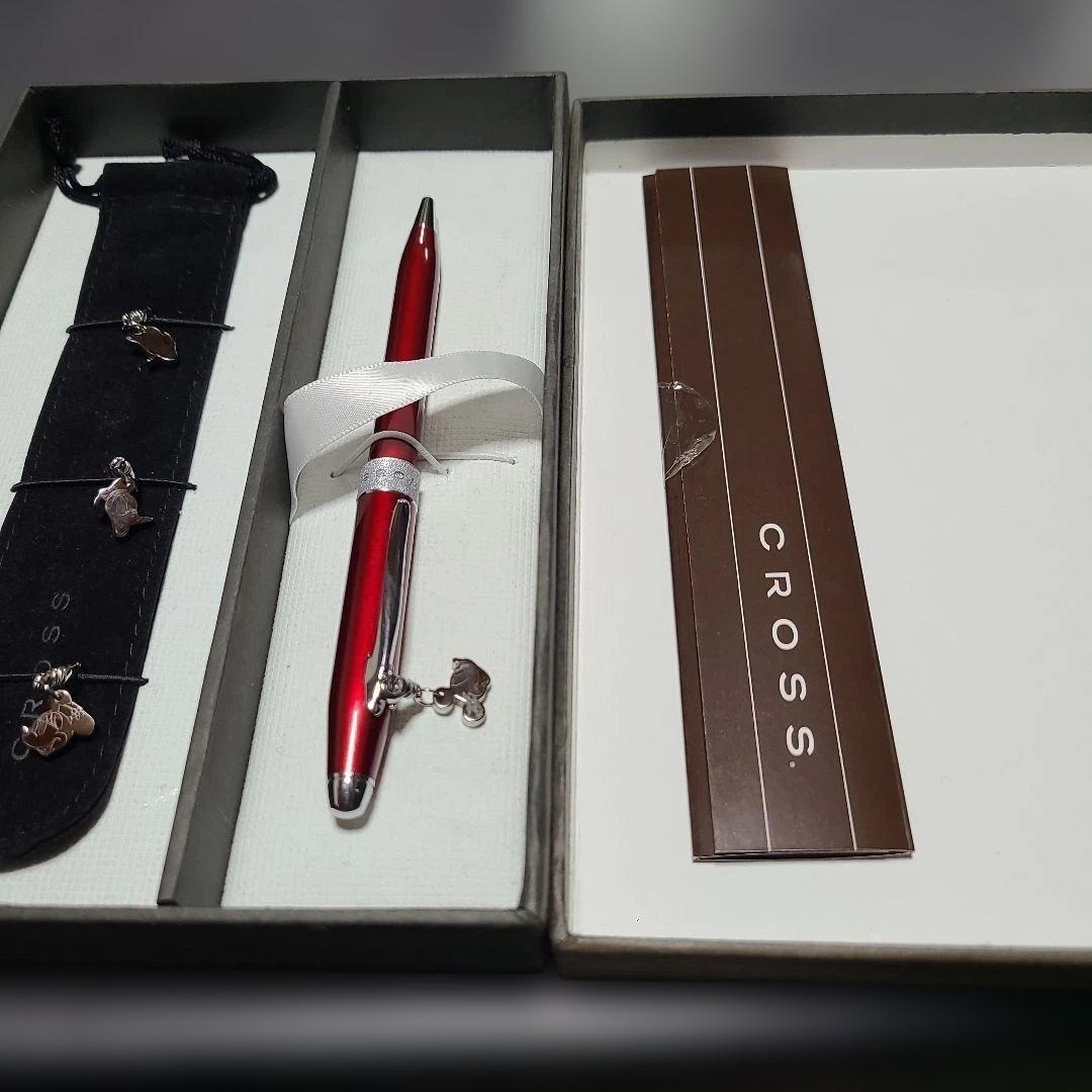 Red Sentiment ballpoint pen by CROSS with metal body and charm with ribbon, simple and elegant design