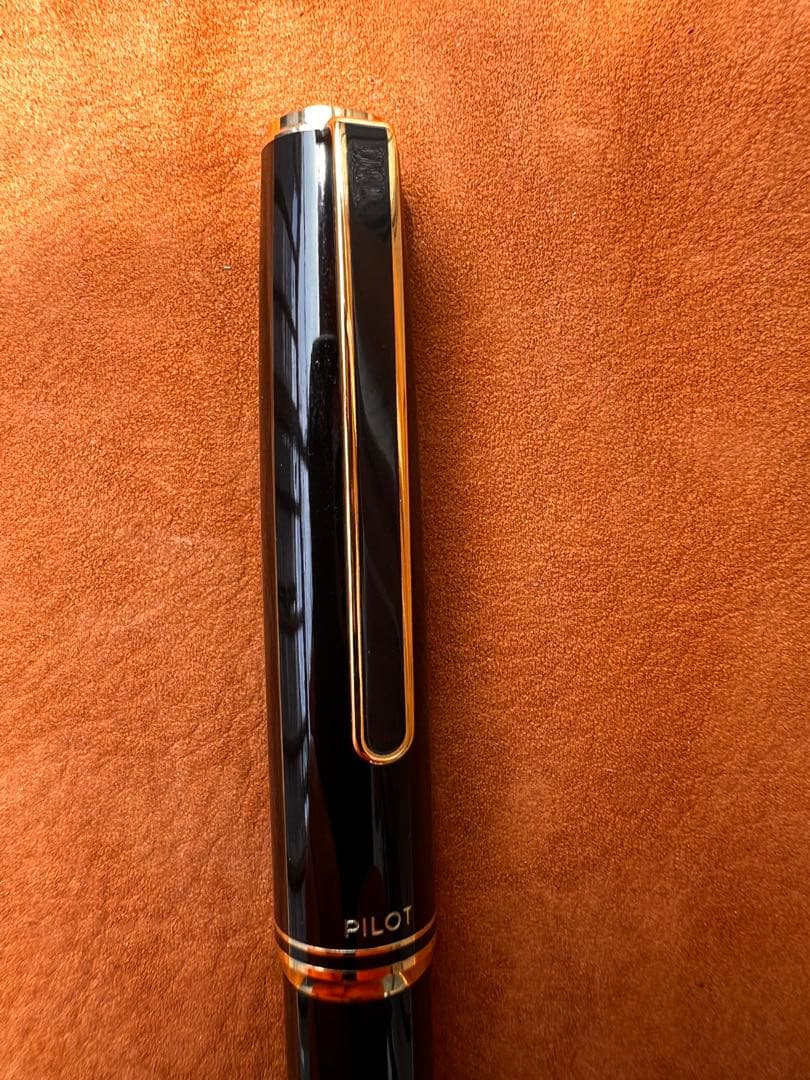 Pilot fountain pen with black body and gold accents featuring an elegant design