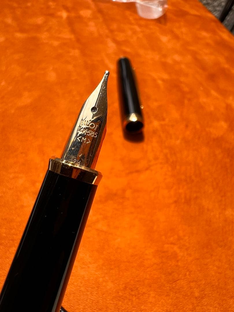 Pilot fountain pen with black body and gold accents featuring an elegant design