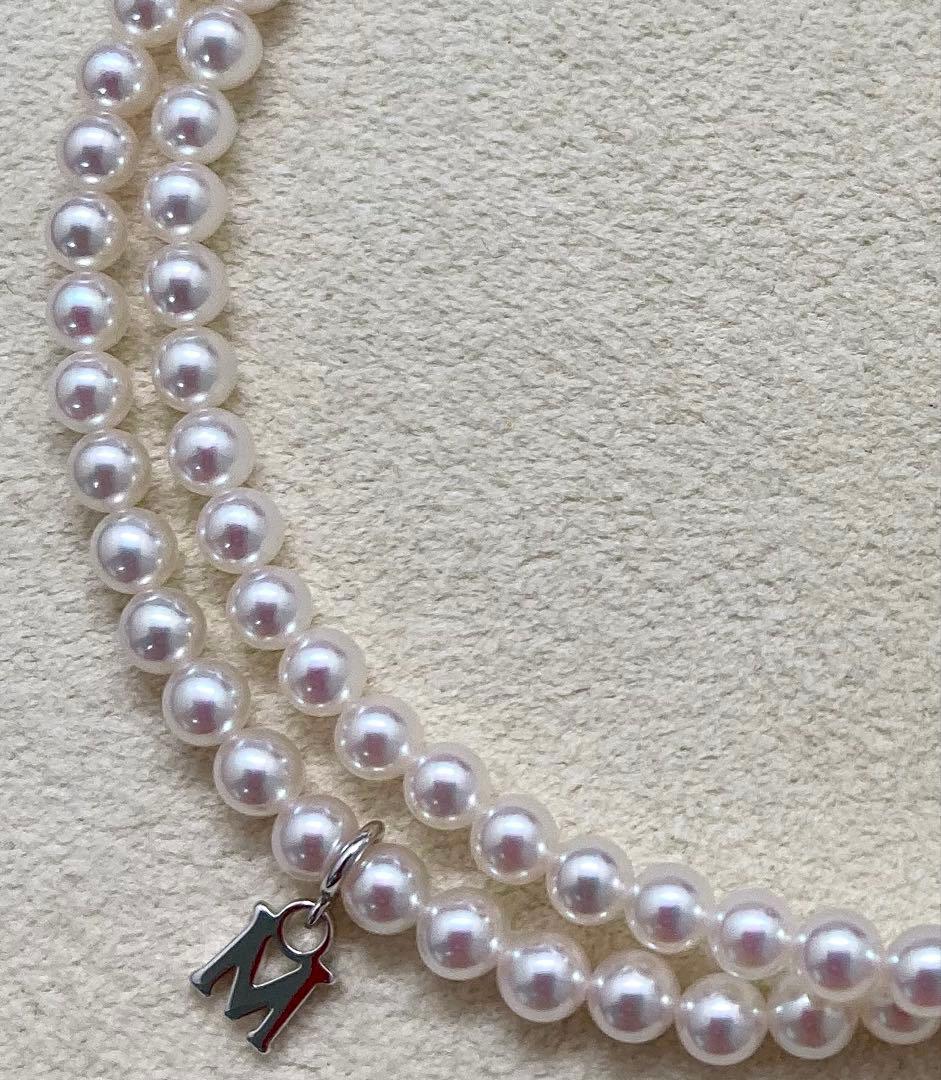 Mikimoto baby pearl necklace with 3.5-4mm pearls, silver lever clasp, and M charm on a 42cm chain