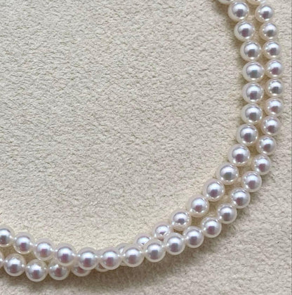 Mikimoto baby pearl necklace with 3.5-4mm pearls, silver lever clasp, and M charm on a 42cm chain