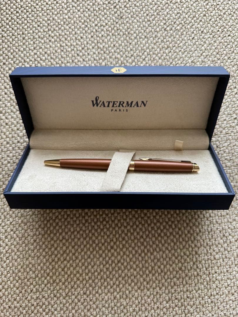 New WATERMAN ballpoint pen in brown color with fine and broad refills, shown unused
