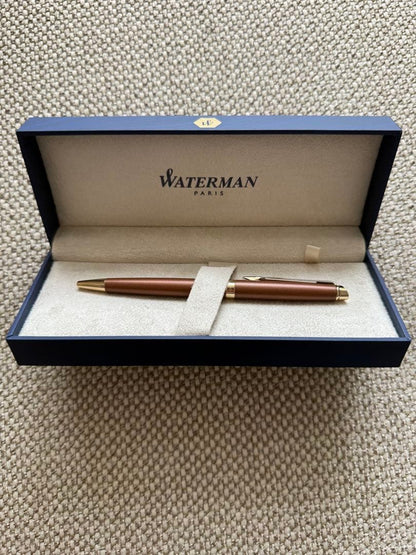 New WATERMAN ballpoint pen in brown color with fine and broad refills, shown unused