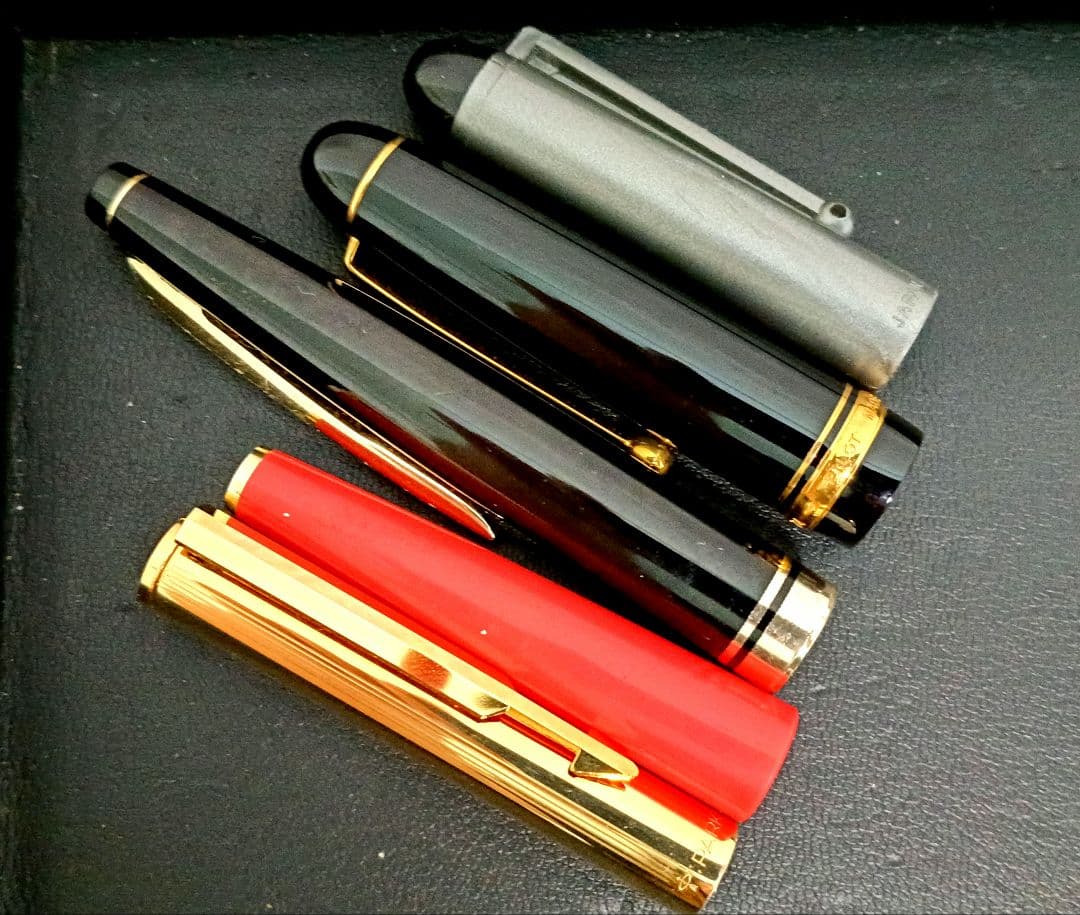Set of 5 fountain pens including PILOT brand with 21K and 14K gold nibs in black, red, and silver colors