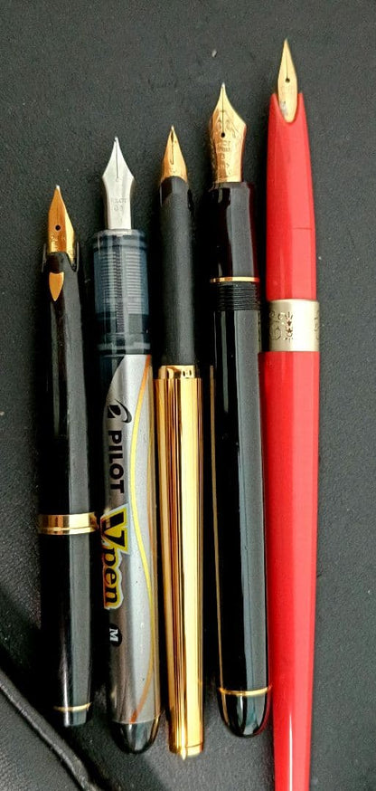 Set of 5 fountain pens including PILOT brand with 21K and 14K gold nibs in black, red, and silver colors