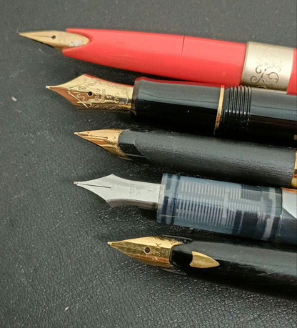 Set of 5 fountain pens including PILOT brand with 21K and 14K gold nibs in black, red, and silver colors