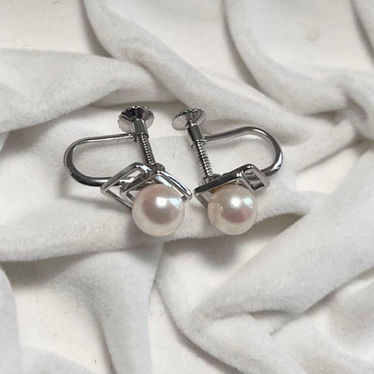 Akoya pearl necklace and matching earrings with pearls sized 6.5-7.0mm and 6.1mm on white background