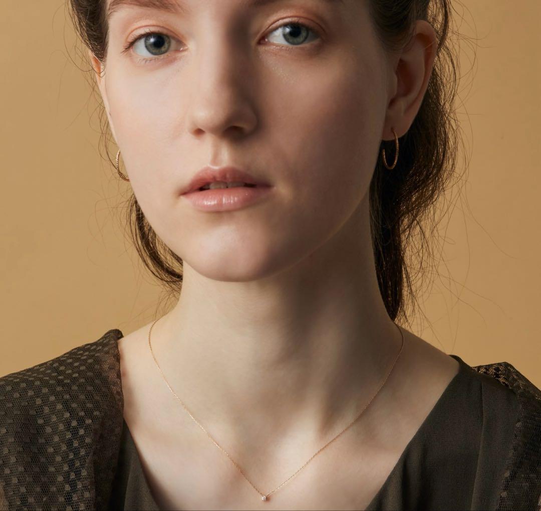K18 gold necklace with a 0.03ct diamond pendant on a fine chain