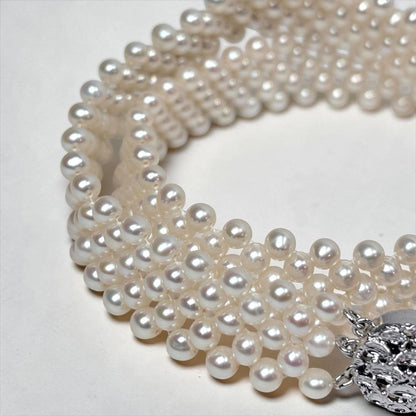 Small pearl three-row knitted necklace with 4.2mm pearls and 45cm length featuring an insert-shaped clasp