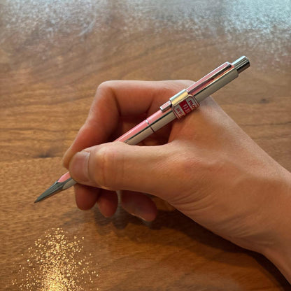 PILOTQUATRO fine black ballpoint pen in pink and white with silver striped design
