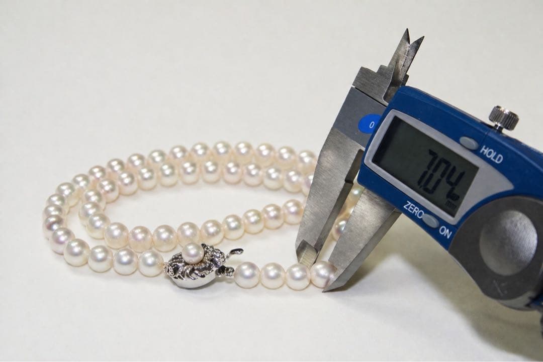 Akoya pearl necklace with 7.0-7.31mm pearls silver stamp displayed with a box