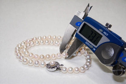 Akoya pearl necklace with 7.0-7.31mm pearls silver stamp displayed with a box