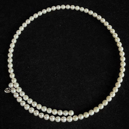 Highest grade TASAKI Akoya pearl choker necklace with 51.5 cm length shown on white background