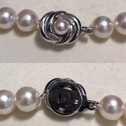 Tasaki Akoya pearl necklace with 9.0 mm pink pearls and silver closure on a white background