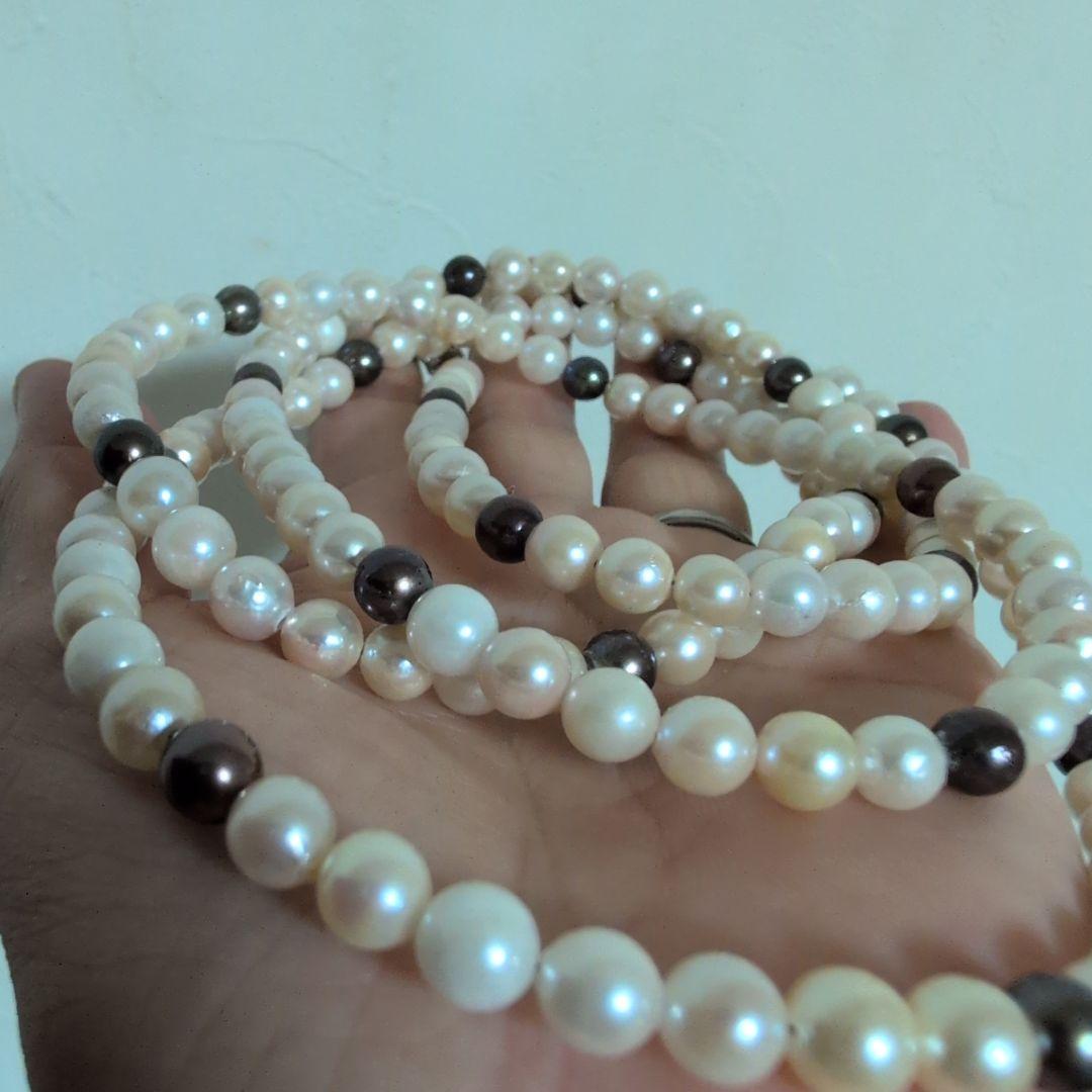 Akoya pearl long necklace with white and cream pearls sized 5.5 to 7 mm showing natural dents and wrinkles