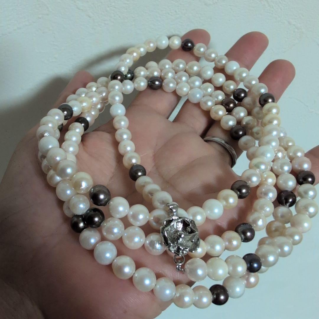 Akoya pearl long necklace with white and cream pearls sized 5.5 to 7 mm showing natural dents and wrinkles
