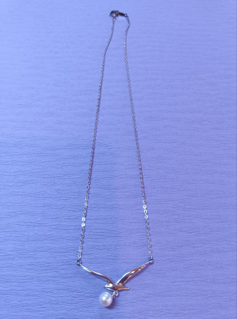 MIKIMOTO Akoya Pearl Necklace in silver with 37 cm length shown on white background