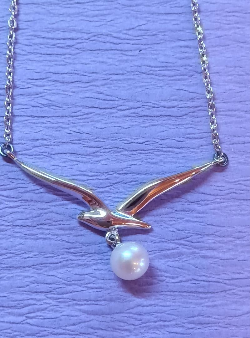 MIKIMOTO Akoya Pearl Necklace in silver with 37 cm length shown on white background
