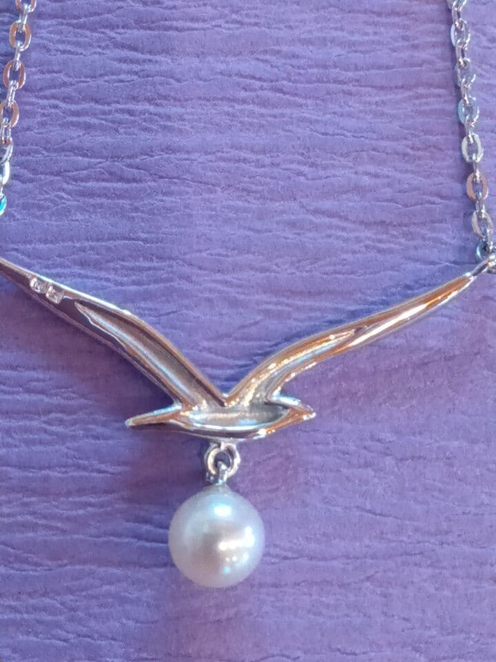 MIKIMOTO Akoya Pearl Necklace in silver with 37 cm length shown on white background
