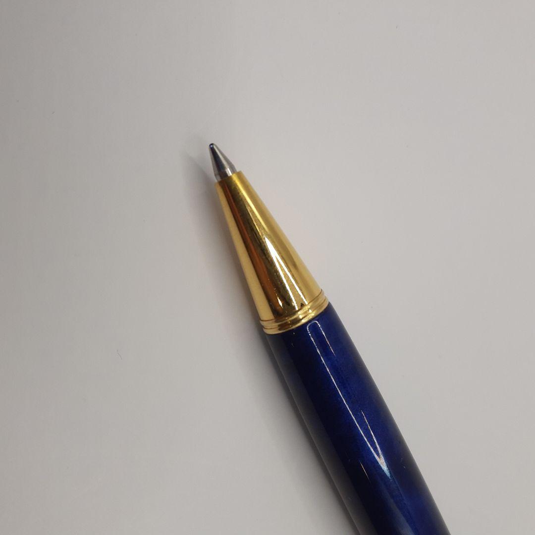 Used Pilot ballpoint pen in blue marble pattern with visible small scratches and paint chips