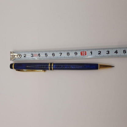 Used Pilot ballpoint pen in blue marble pattern with visible small scratches and paint chips