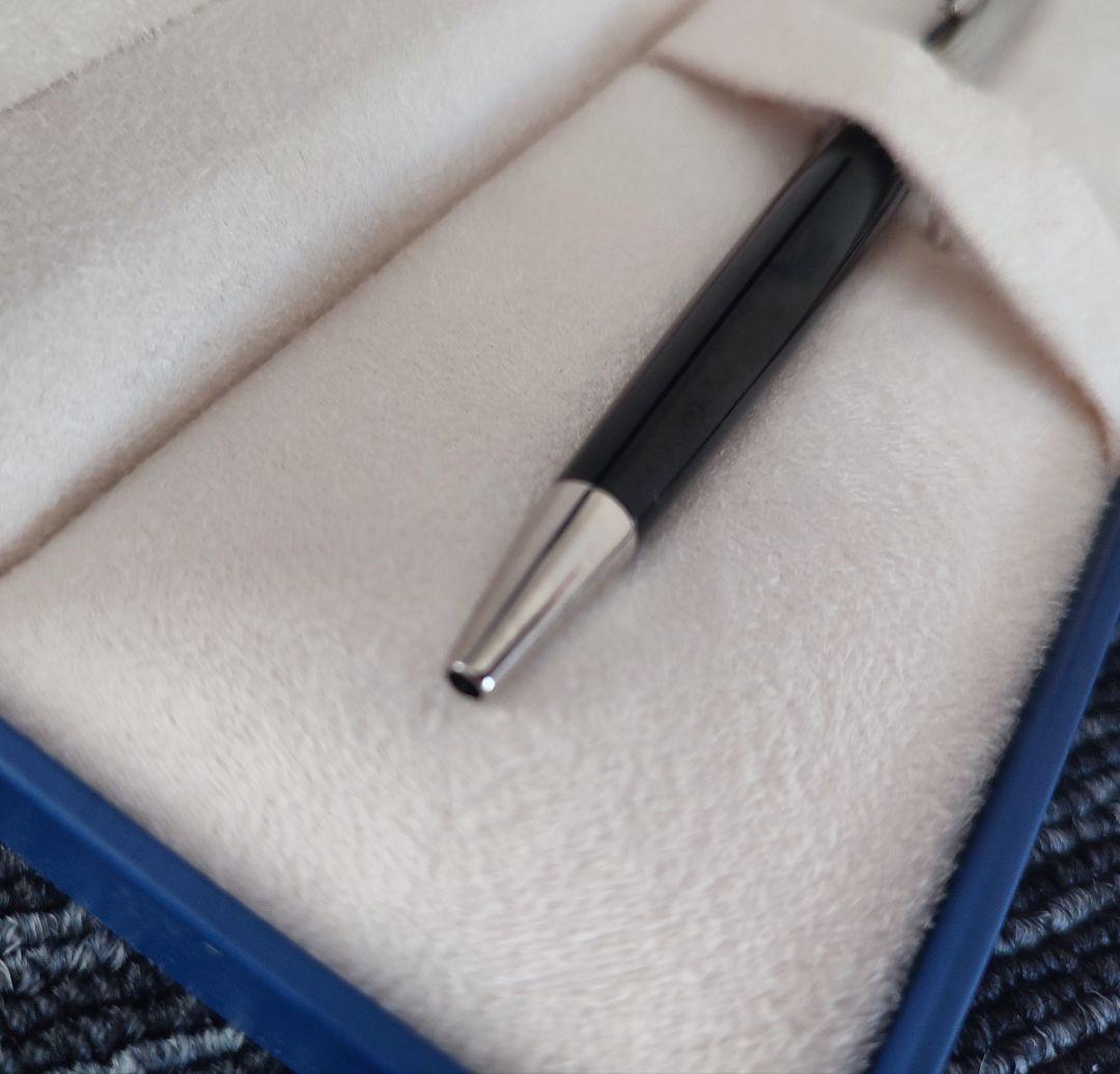 WATERMAN Paris ballpoint pen with silver wave pattern cap and black body beside a blue gift box