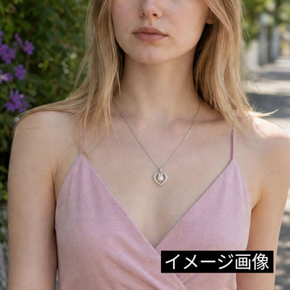 Mikimoto pearl necklace with silver heart pendant and 37 cm Akoya pearls on white background