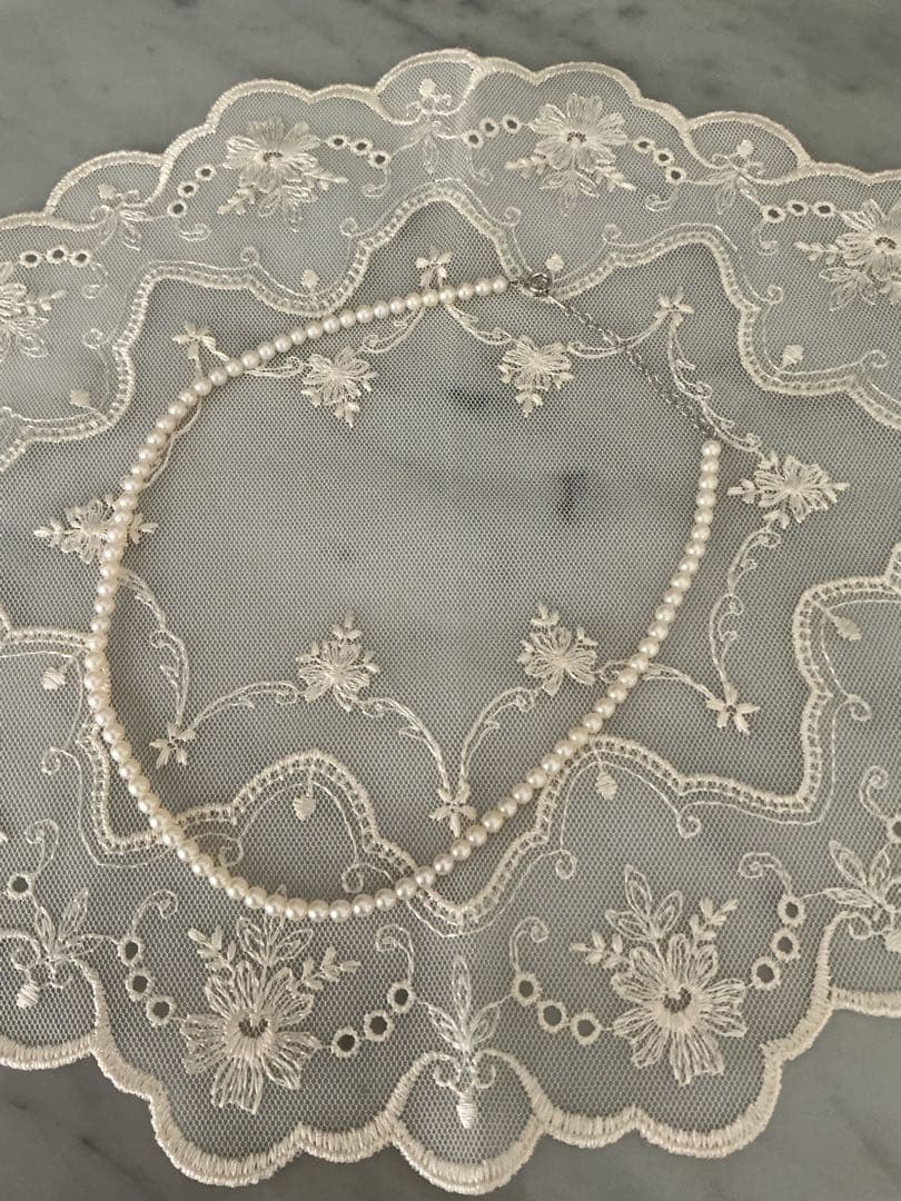 Tasaki K18WG freshwater pearl necklace with 43cm length and 3.5-4mm white pearls on white background