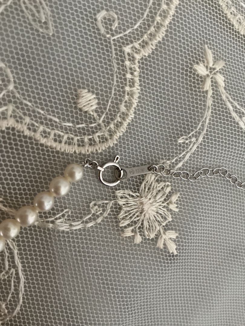Tasaki K18WG freshwater pearl necklace with 43cm length and 3.5-4mm white pearls on white background