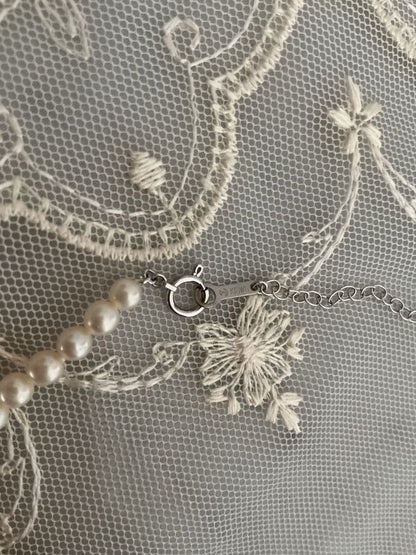 Tasaki K18WG freshwater pearl necklace with 43cm length and 3.5-4mm white pearls on white background