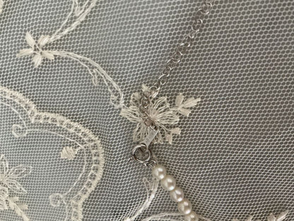 Tasaki K18WG freshwater pearl necklace with 43cm length and 3.5-4mm white pearls on white background