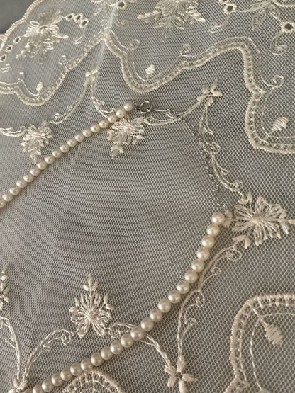 Tasaki K18WG freshwater pearl necklace with 43cm length and 3.5-4mm white pearls on white background