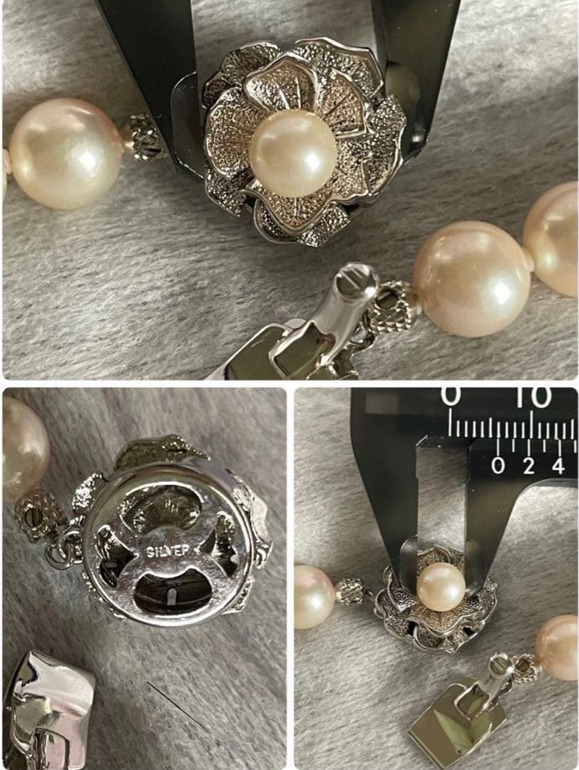 Akoya pearl necklace with approximately 43 cm length and matching round pearl screw-back earrings set on a white background