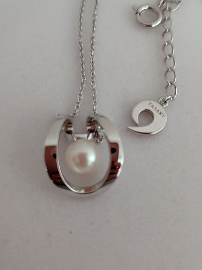 TASAKI silver pearl necklace measuring 43cm with delicate pearls and sleek silver chain