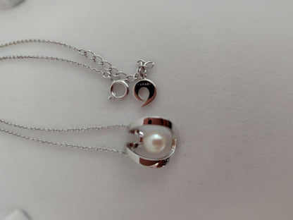 TASAKI silver pearl necklace measuring 43cm with delicate pearls and sleek silver chain
