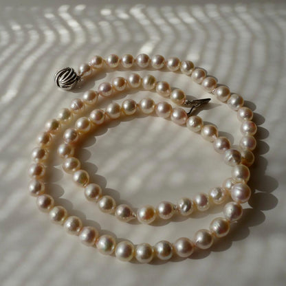 Akoya Pearl Baroque Necklace with pink 8.4-7.6mm pearls on 61cm gold and silver chain from Japan