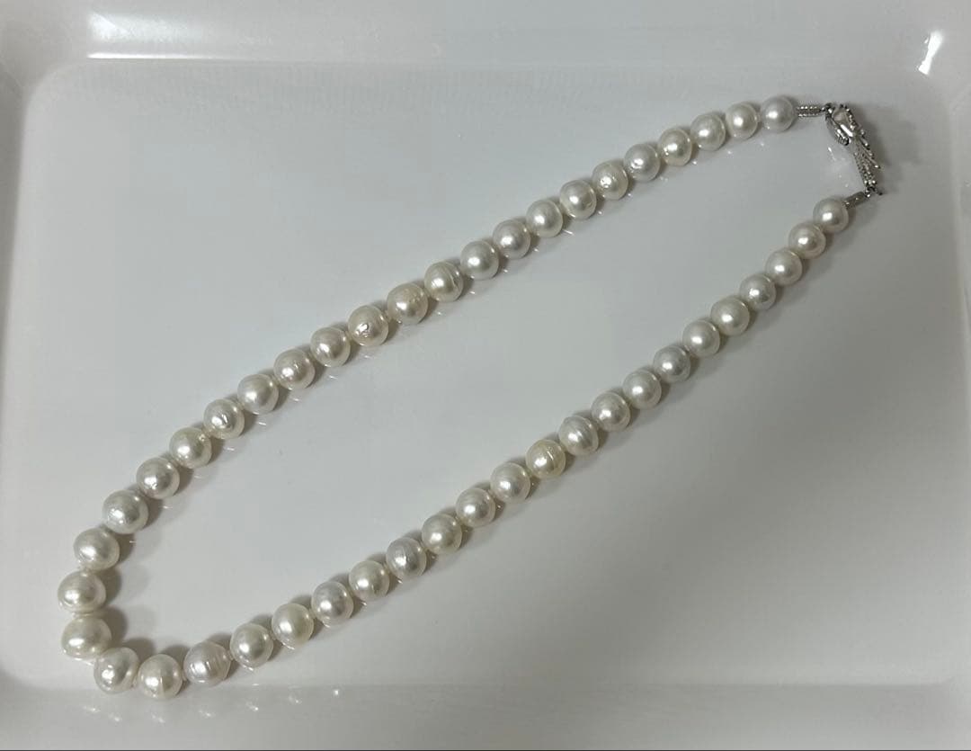 Nanyou white pearl necklace with pearls sized 10.7mm to 13.5mm, 59cm length, certified by Pearl Science Research Institute