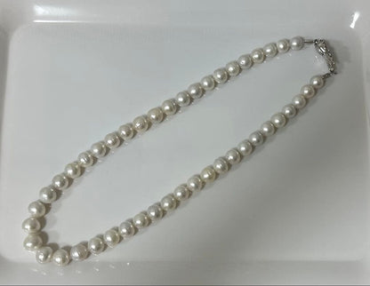 Nanyou white pearl necklace with pearls sized 10.7mm to 13.5mm, 59cm length, certified by Pearl Science Research Institute