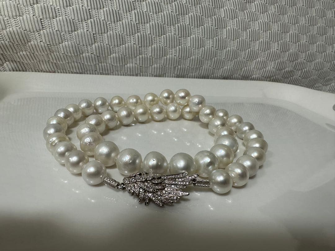 Nanyou white pearl necklace with pearls sized 10.7mm to 13.5mm, 59cm length, certified by Pearl Science Research Institute