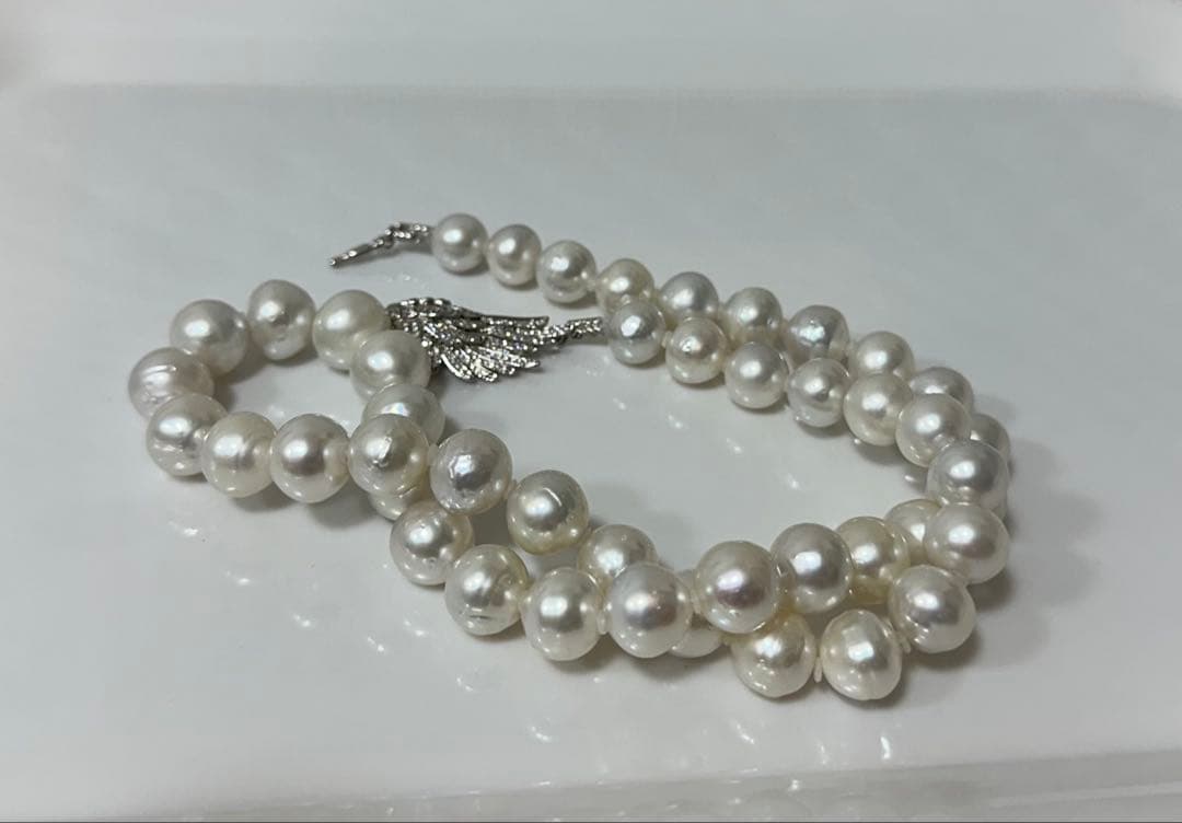 Nanyou white pearl necklace with pearls sized 10.7mm to 13.5mm, 59cm length, certified by Pearl Science Research Institute